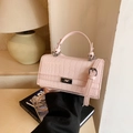 Light pink croc-embossed small square handbag with silver twist lock and shoulder strap - Pink