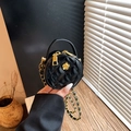 Mini black round quilted shoulder bag with gold camellia logo and chain strap - Black