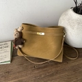 Retro mustard yellow matte tote bag with golden twist lock and a brown knit bunny pendant - Caramel With Pendant