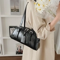 Glossy black PU leather underarm pillow bag with adjustable straps and zipper closure - Black