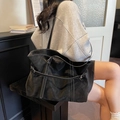 Large black tote bag with white contrast stitching and soft matte faux leather finish - Black