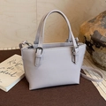 Chic lilac bucket bag with lychee pattern texture and adjustable shoulder strap - Smoky Purple