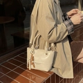 Chic beige bucket bag in glossy PU leather with retro wooden bead charm and long strap - Beige With Charm