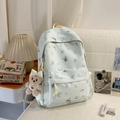 Hellblauer Nylon Schulrucksack mit silbernen Schmetterlingen und Plüschbär-Anhänger - Blau mit Anhänger