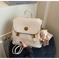 Detail of off-white faux leather backpack with gold twist lock and cute bear charm - Beige With Charm