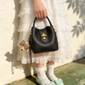 Black litchi grain bucket bag with gold hardware and a cute brown bear charm - Black with Pendant
