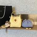 Light yellow bucket bag with lychee grain leather, stripe pouch, and cute bear charm - Yellow with Pendant