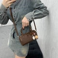 Dark brown textured leather cylinder handbag with cute bear and pompom charms for women - Brown