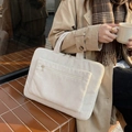 Off-white corduroy laptop tote bag with dual zippers and striped fabric texture - White