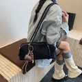 Minimalist black cylinder shoulder bag in nylon with long straps and brown charm - With Pendant / Black