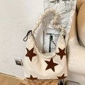 Chic beige canvas hobo bag with brown plush star and ruched shoulder strap design - Off White