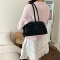 Minimalist black rectangle shoulder bag with visible stitching and star charm detail - Black