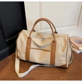 Large beige canvas travel duffel bag with brown leather handles and wide shoulder strap - Off White