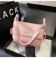 Detailed macro view of pink litchi grain leather crossbody bag with logo lettering - Pink