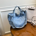 Washed blue denim tote bag with dual handles and adjustable strap for daily use - Light Blue