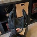 Minimalist black suede half-moon shoulder bag with knot strap and silver metallic detail - Black