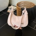 Pale pink leather crescent bag with geometric stitching and knotted rope handle - Pink