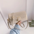 Chic cream leather crossbody bag with elegant gold square metal buckle and adjustable strap - Cloud White