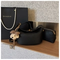 Elegant black lychee leather hobo handbag with golden clasp and cute puppy charm - Premium Black With Bear Pendant
