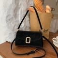 Elegant black suede crossbody phone bag featuring a signature golden metal buckle - Premium Black