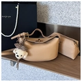 Khaki lychee leather handbag with plush dog charm and matching zipper pouch - Khaki With Pendant