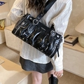 Chic black pleated shoulder bag in glossy leather finish with silver metal rings - Black