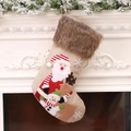 Linen Christmas stockings with plush fur trim featuring Santa and Reindeer on white fireplace - Santa Design