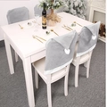 Grey Christmas hat chair covers with white pom-poms for festive dining room decor - Gray And White Christmas Hat Shape