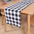 Classic black and white buffalo plaid table runner on a wooden dining table for decor - White & Black Plaid / Table Flag