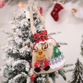 Christmas burlap gift bag with reindeer and tree patches on a snowy tree background - Reindeer Gift Tote Bag