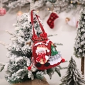 Christmas burlap gift bag with snowman and tree applique hanging on a snowy tree branch - Snowman Gift Tote Bag
