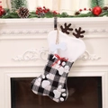 Plaid bone-shaped Christmas stocking with reindeer antlers and bow for holiday decor - Black & White Plaid Paw Style