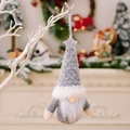 Christmas gnome ornament with gray knit hat and silver sequin star on a white branch - Gray