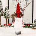 Detail of Christmas wine bottle cover with red sequins, reindeer antlers and white beard - Red Sequin Bottle Cover