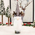 Close-up of a Christmas gnome wine bottle cover with grey sequins and white beard decor - Silver Sequin Bottle Cover