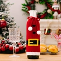 Gestrickte Weinflaschenhülle im Weihnachtsmann-Design mit Pompons und Gürtel Deko - Gürtel-Stil