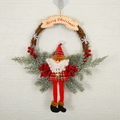 Christmas wreath featuring a plush Santa Claus and a wooden Merry Christmas sign - Large Branch Wreath Santa Claus