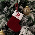 Close-up of red knit Christmas stocking with embroidered letter E and snowflake accents - Style E (Red Knit Embroidered E)