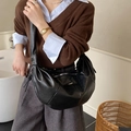 Chic black crescent hobo bag made of glossy faux leather in a retro slouchy style - Black