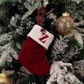 Macro shot of red knit Christmas stocking with embroidered letter Z and cable knit texture - Style Z (Red Knit Embroidered Z)