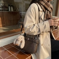 Dark brown retro crossbody bag with plush bunny charm and minimalist buckle detail - With Charm / Coffee