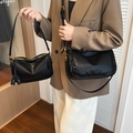 Minimalist black leather shoulder bag with tassel charm and adjustable strap - L / Premium Black