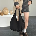Large black nylon hobo tote bag with silver metal eyelets and minimalist slouchy silhouette - Black