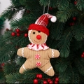Makro-Detail von Lebkuchenmann-Plüschfigur mit Cord-Struktur und kleiner Weihnachtsmütze - Stern Stil Männlich