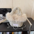 Detail of plush off-white handbag with faux fur texture and silver bead chain strap - Apricot