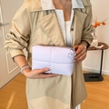 Quilted light purple clutch bag in lilac fabric with silver zipper and letter A detail - Purple