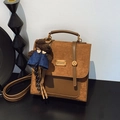 Brown patchwork retro backpack with top handle and cute teddy bear charm accessory - With Charm / Brown