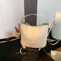 Chic beige lychee grain bucket bag with matching wide strap and leopard print charm - With Pendant / Off White