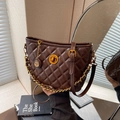 Retro dark brown quilted bucket bag with gold chain and circular twist lock detail - Brown