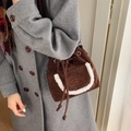 Dark brown suede drawstring bucket bag with white faux fur trim and embroidered logo - Coffee